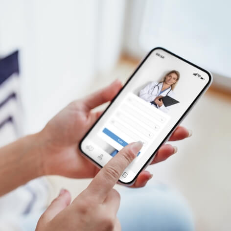 female-exploring-options-on-health-app-via-her-sma-2023-12-13-19-34-58-utc-1