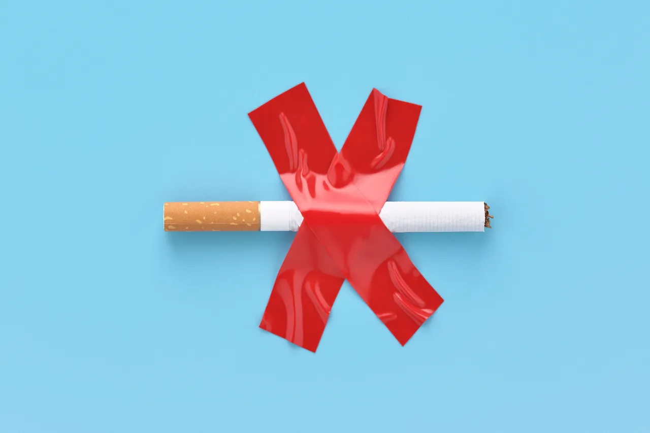 crossed out and glued cigarette no smoking concep utc