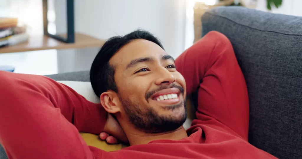 happy lazy and relax a man on a sofa in living r utc